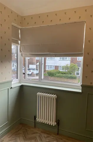 Bedroom freshly wallpapered and painted panelling showing professional decorating work