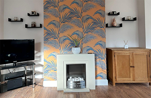 A floral wallpapered chimney breast demonstrating expert pattern matching