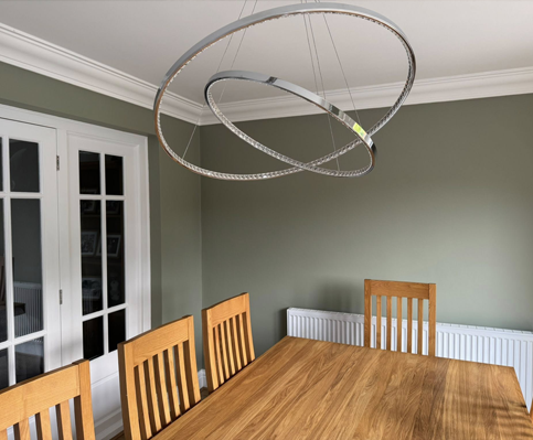 Olive green painted dining room with professional wall finishing