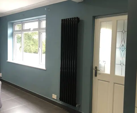 Newly painted blue walls in living room showing quality painting work