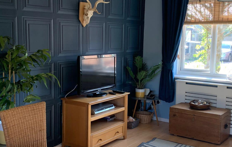Interior of a beautifully decorated residential room showing professional painting and wallpaper work